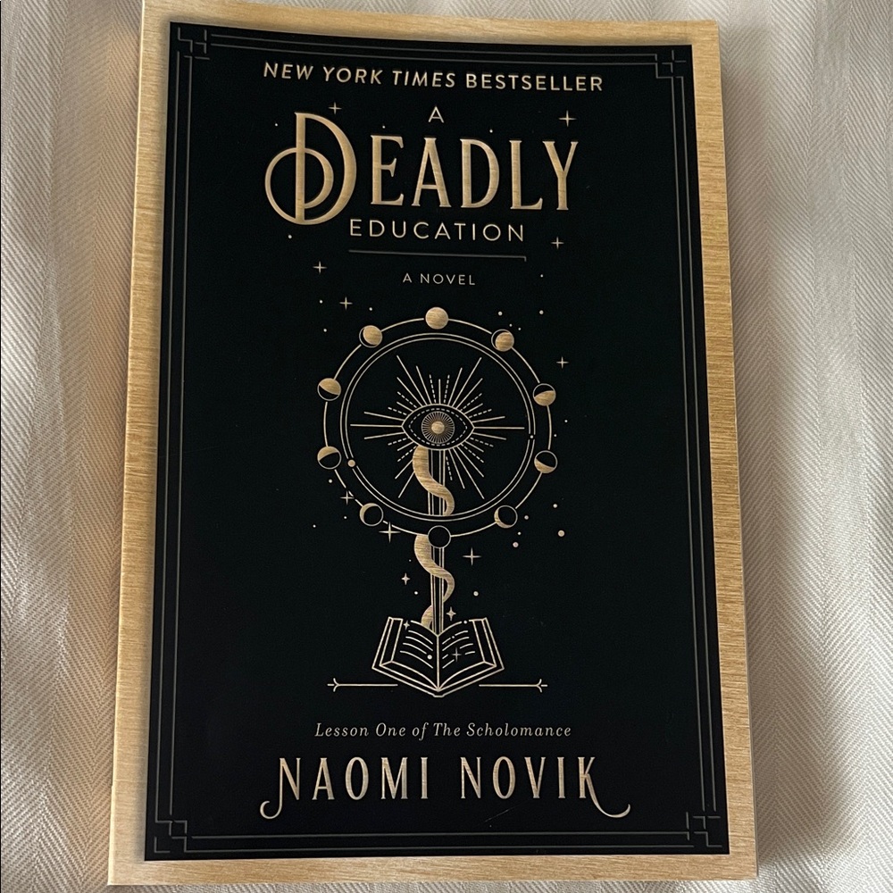 A Deadly Education by Naomi Novik - Black & Gold Hardcover Style
